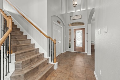 Two story foyer as you enter the home.