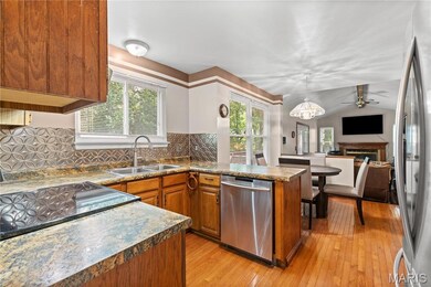 The kitchen features stainless steel appliances, AND the refrigerator stays!