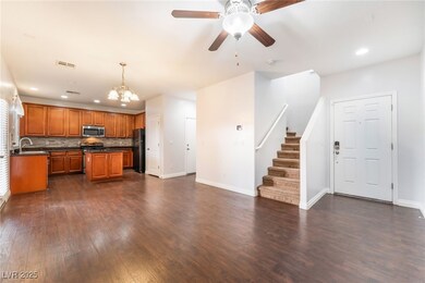 Kitchen featuring brown cabinetry, dark countertop