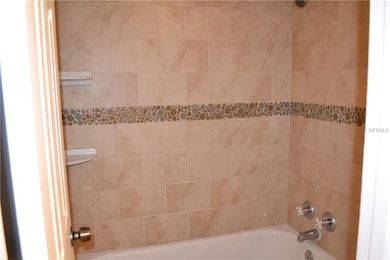 remodeled bathroom with tub shower combination