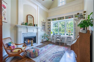 Sitting room with high vaulted ceiling, wood finis