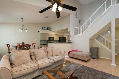 Living room featuring stairway, light wood-type f
