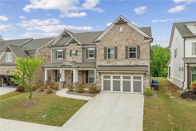Craftsman-style home with a garage, a front yard, 