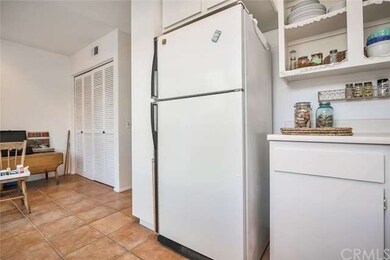 Kitchen looking into the dining nook and laundry r