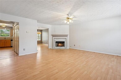 Unfurnished living room featuring light wood finis