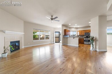 Wood floors and fireplace in living room