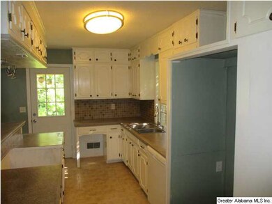 Kitchen has breakfast bar.