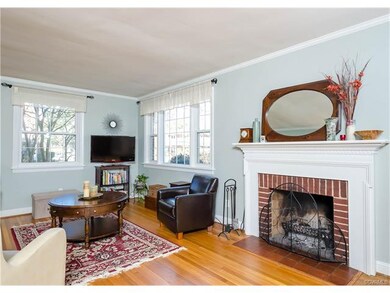 The living room has a brick, wood-burning fireplac