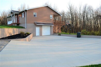 Large concrete slab with adobe finished exterior