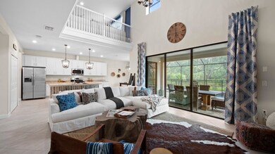 Perfect for small parties or just relaxing, this Great Room features two-story tall ceilings, large 