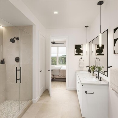 Ensuite bathroom with a shower stall, baseboards,