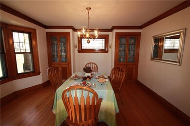 Twin built-in china cabinets with leaded glass are