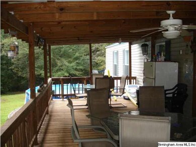 Covered porch Adjacent to the porch is an above gr