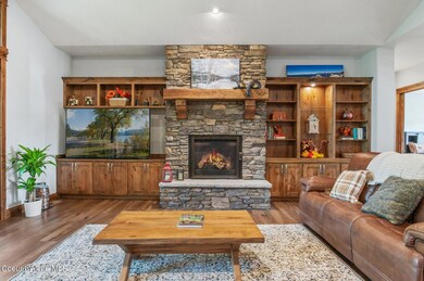 Stone gas fireplace with builtins