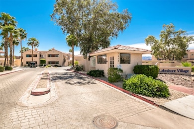 View of front of house featuring stucco siding, a