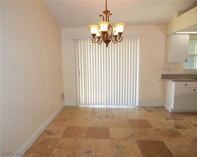 Unfurnished dining area featuring a chandelier
