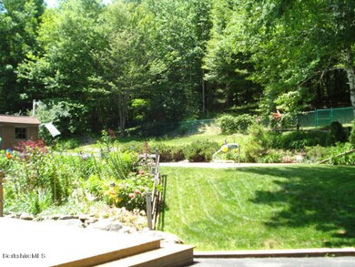 Many backyard flower gardens