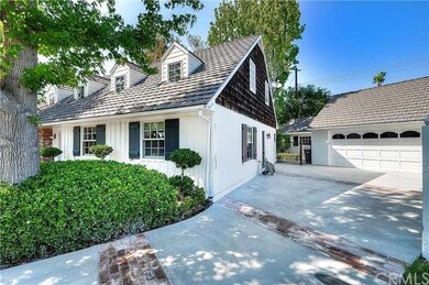 Newer driveway with brick inlay + newer 50yr roof 