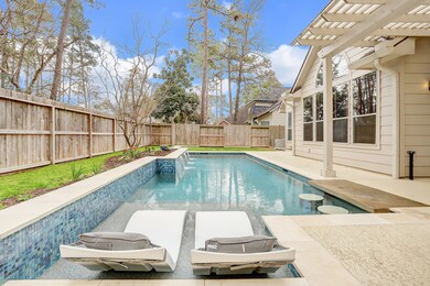 The owner spared no expense on this stunning heated pool with built in bar seating, lounge area, and elegant water feature. No back or side neighbors for added privacy as well.