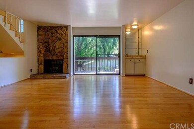 The living room with wet-bar opens to a spacious o