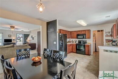 Dining to kitchen view.  Easy care vinyl flooring,