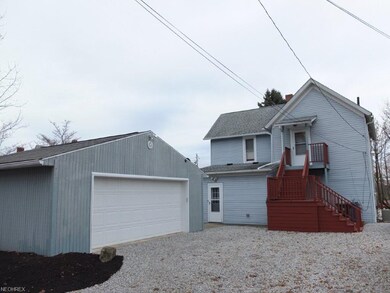 Rear exterior with large parking lot and oversized