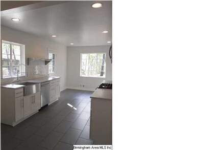 Spacious kitchen with an eat-in area and access to