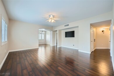 Empty room featuring visible vents, baseboards, da