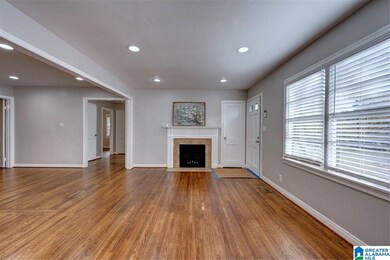 The freshly refinished hardwoods make this room an