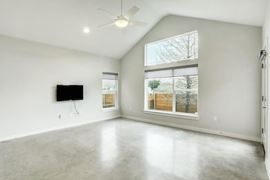Unfurnished living room featuring ceiling fan, hi
