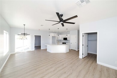 Unfurnished living room with light wood finished f