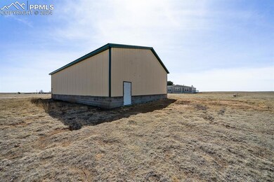View of side of property with a rural view