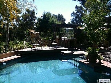 pool, spa, waterfall in the backyard overlooking t