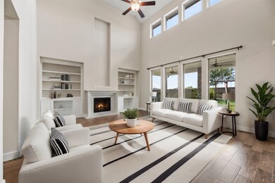 A chic living room space flooded with natural light is absolutely delightful! The wall of windows not only brings in abundant sunlight but also offers expansive views of the surrounding landscape, connecting the indoors with the outdoors in a seamless way.