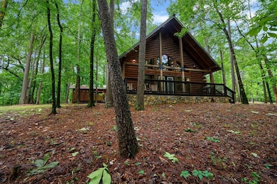 View of property exterior featuring log veneer sid