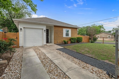 Single story home with concrete driveway, an atta