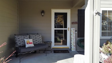 Property entrance featuring a patio area
