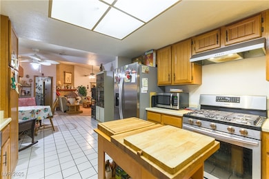 Kitchen with stainless steel appliances, under cab