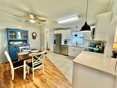 Kitchen featuring light tile patterned floors, whi