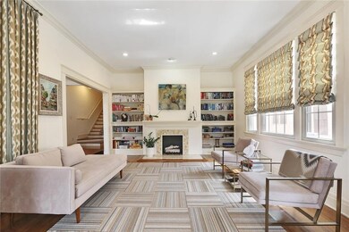 Living room with fireplace, built in book shelves