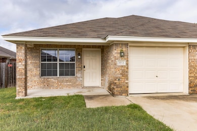 View of front of house with an attached garage, a