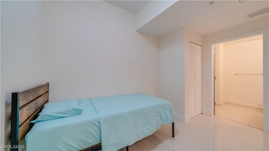 Tiled Den featuring a half bathroom