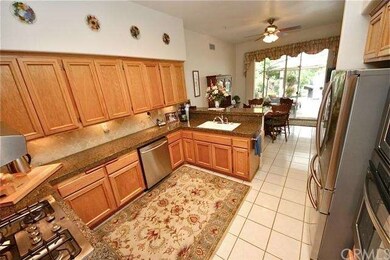 Richly upgraded kitchen with granite counter tops