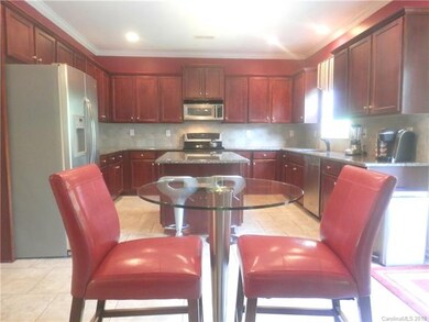Cherry Cabinets, Stainless Steel Appliances, Tiled
