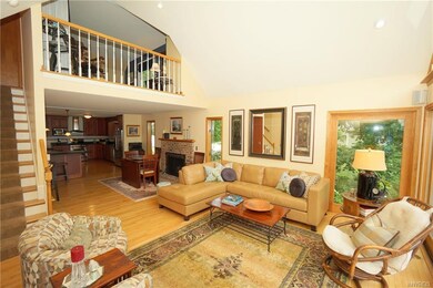 A second story bedroom  overlooks the great room a