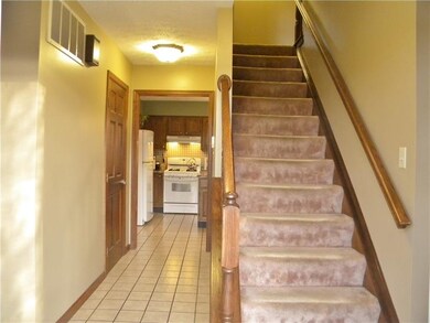 Large entry way with coat closet and 1/2 bath.