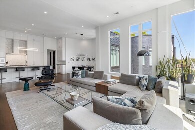 Living room featuring visible vents, wood finished