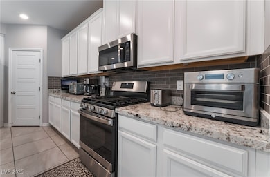 Kitchen featuring appliances with stainless steel