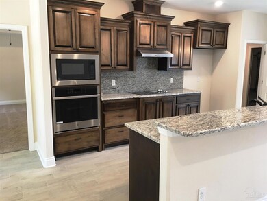 Kitchen features a wall oven & separate cooktop.