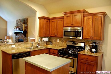 Kiitchen boasts granite counter tops and stainless